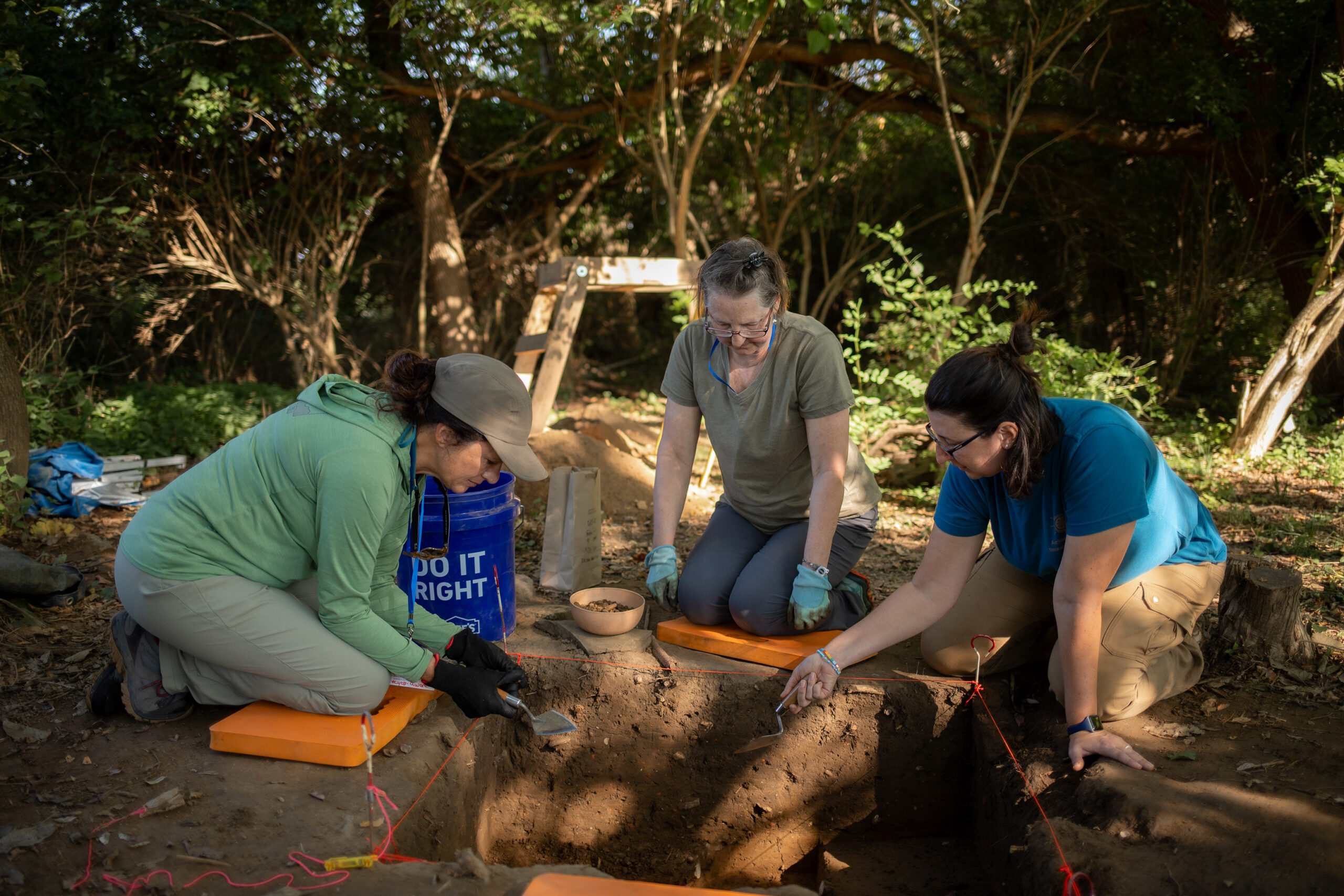 Archaeology dig at ARI being conducted by 3 adults